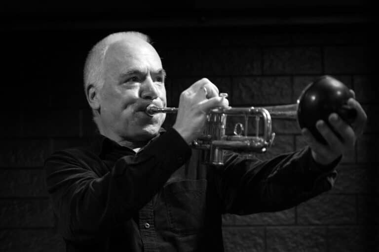 Black and white photo of Chris Batchelor playing the trumpet.