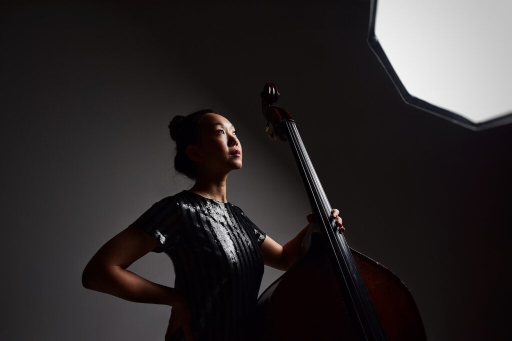 Linda May Han Oh holding acoustic bass
