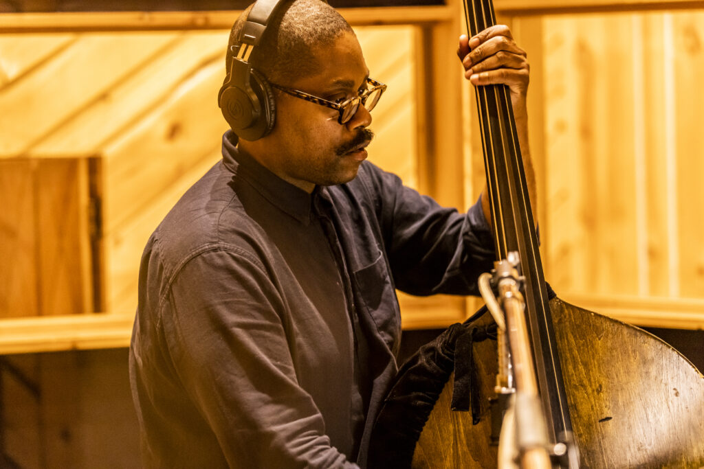 Vicente Archer playing bass in the recording studio